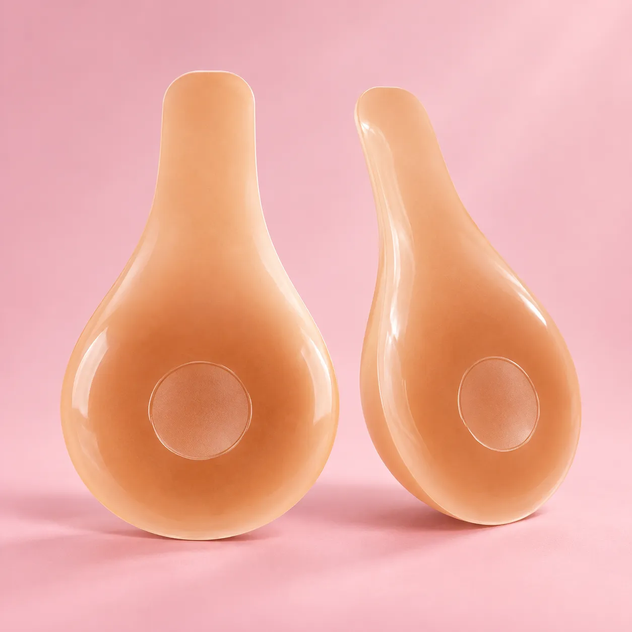 Pair of Zayra Belle Lift silicone covers on a blush background